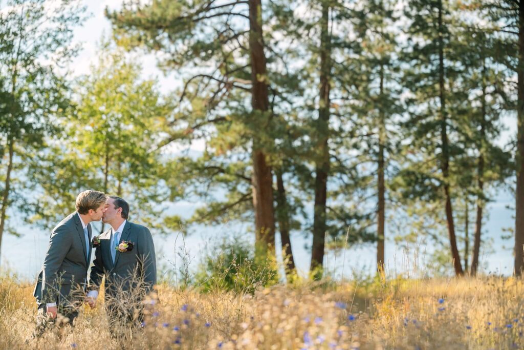 Two grooms first look moment at a private lakefront estate at Glenbrook, NV