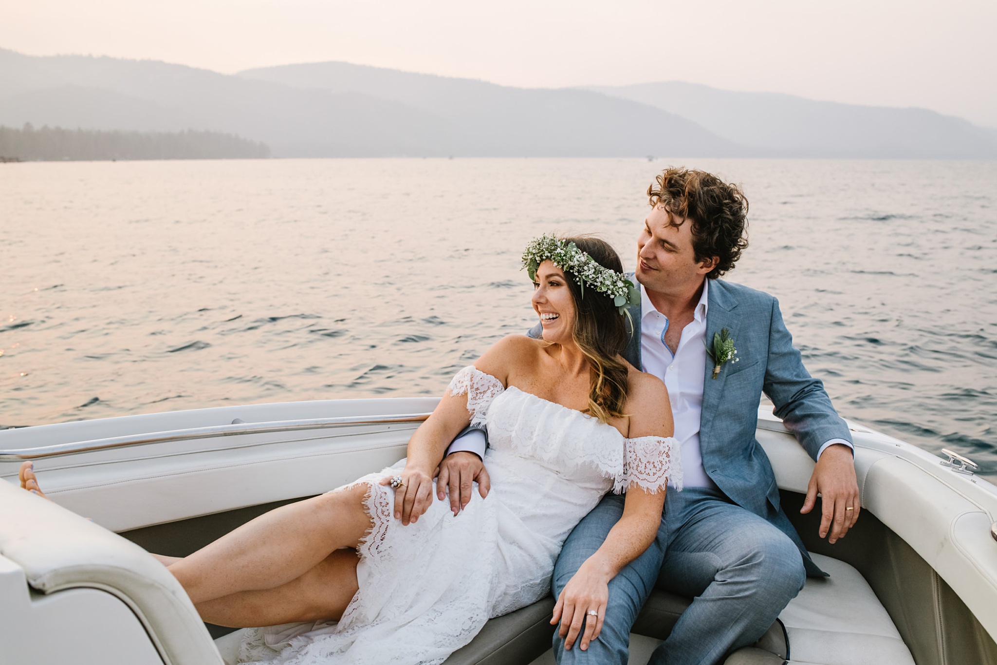 Bride and Groom on tehir boat after getting married during intimate wedding in their Lake Tahoe private residence