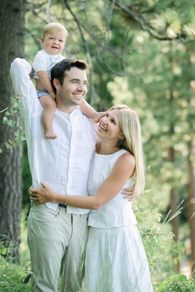 Happy parents with a baby on top of dad's shoulders