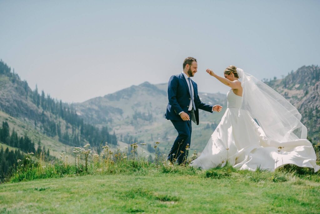 Bride and Groom dancing during portraits at Palisades Tahoe, views of Kt-22
