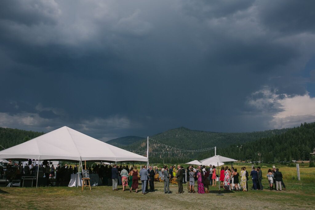 Olympic Valley stables reception tent under dramatic stormy skies