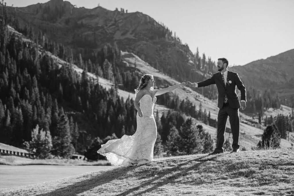 Bride and groom candid capture of them at Palisades Tahoe in blacka nd white