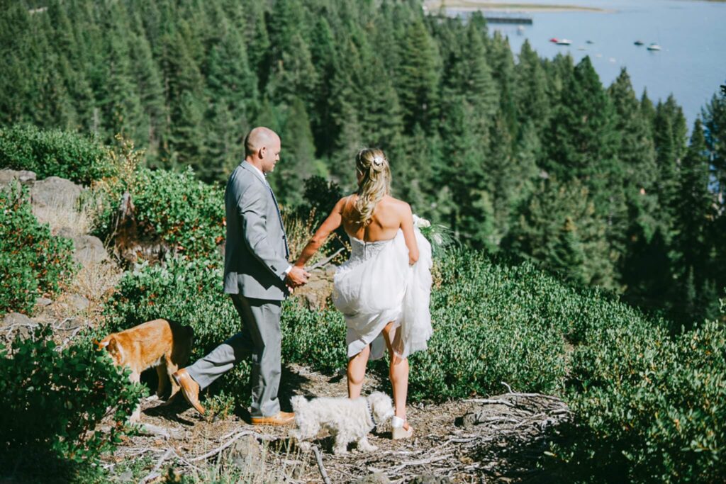 Bride and Groom at first look with their dogs up in RockyRidge in Tahoe city, overlooking Lake Tahoe