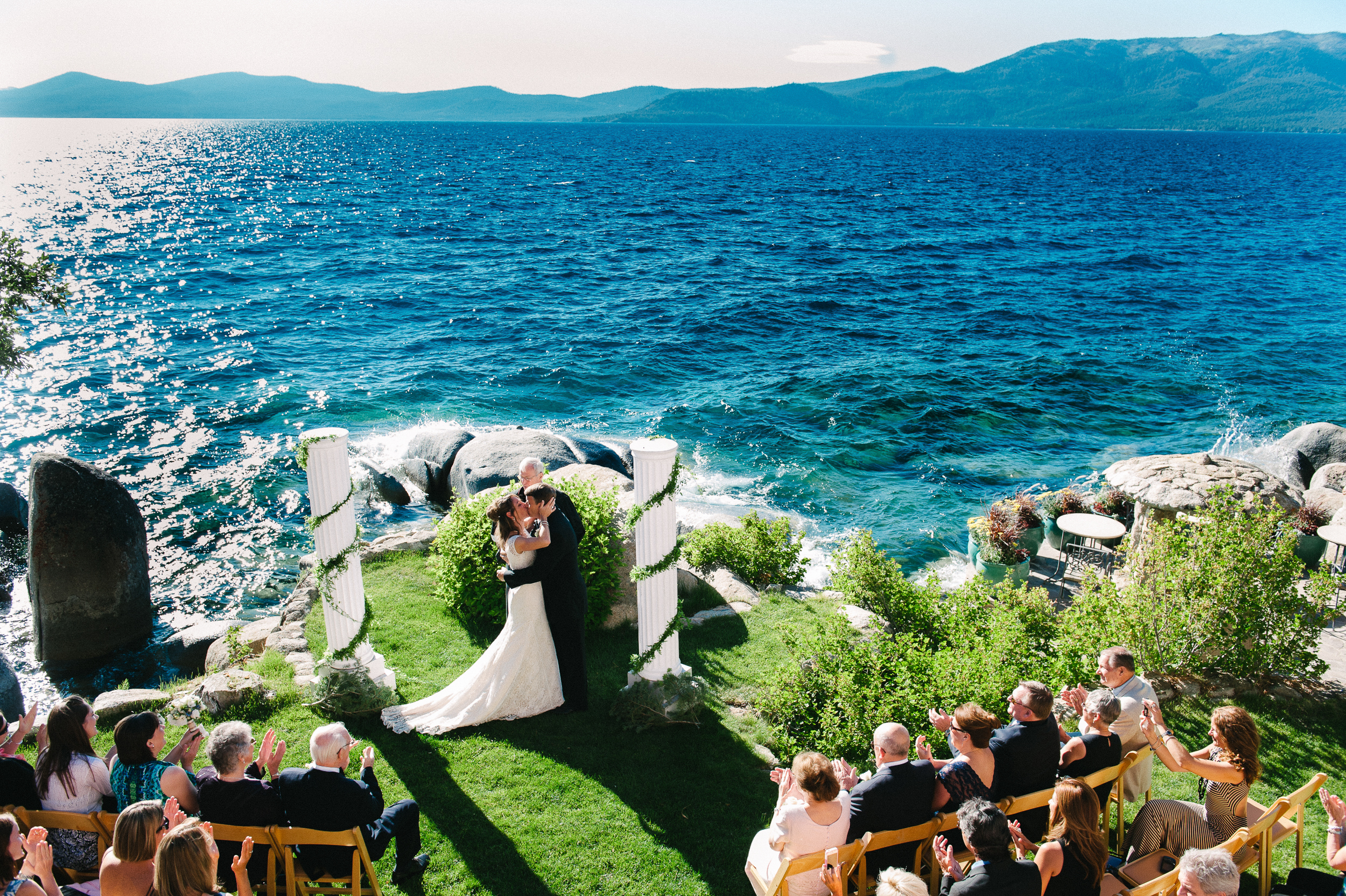 Bride and Groom tie the knot on one of the most iconic Lake Tahoe lakefront wedding venues with rich historical past the Thunderbird Lodge. Ceremony site photographed from top by Annie X Photographie.