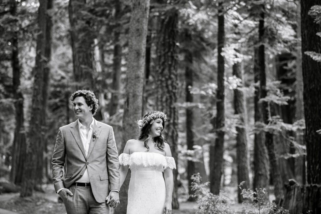 bride and groom in forest portrait in black and white with editorial style relaxed portrait by Annie X