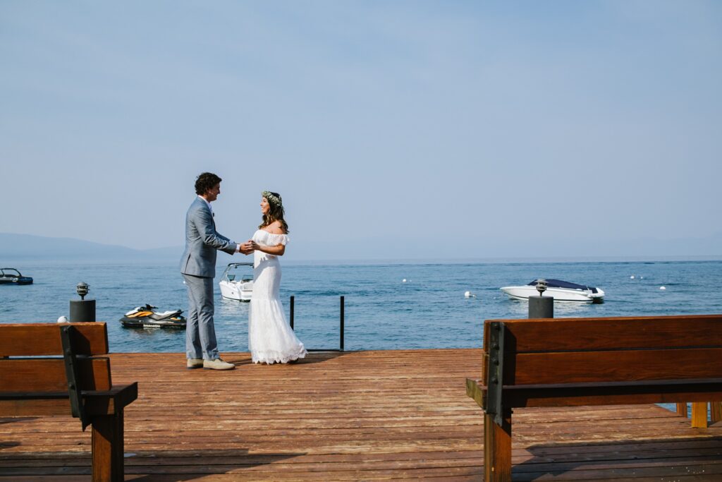 first look at Lake Tahoe on pier while wild fire season during intimate weddings