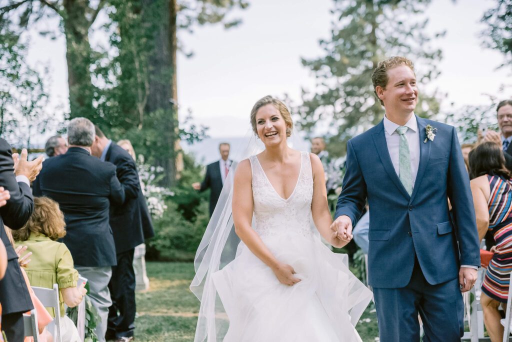 Just married feeling with bride and groom walking down the aisle at their ceremony at one of Lake Tahoe wedding venues Hyatt Tahoe