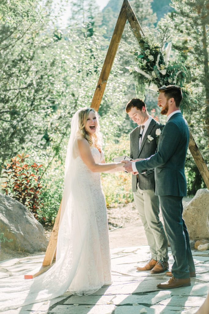 bride and groom getting married during their ceremony exchanging vows at Plumpjacks at Palisades Tahoe