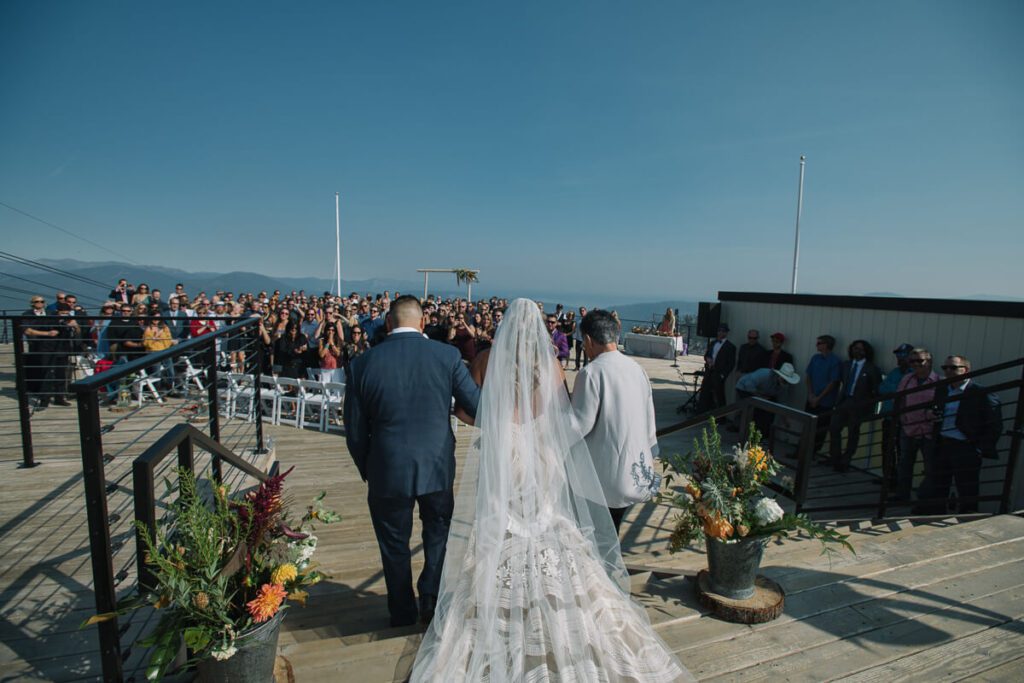 High Camp Palisades Tahoe ceremony of bride walking down the aisle captured by Palisades Tahoe photographer Annie X Photographie