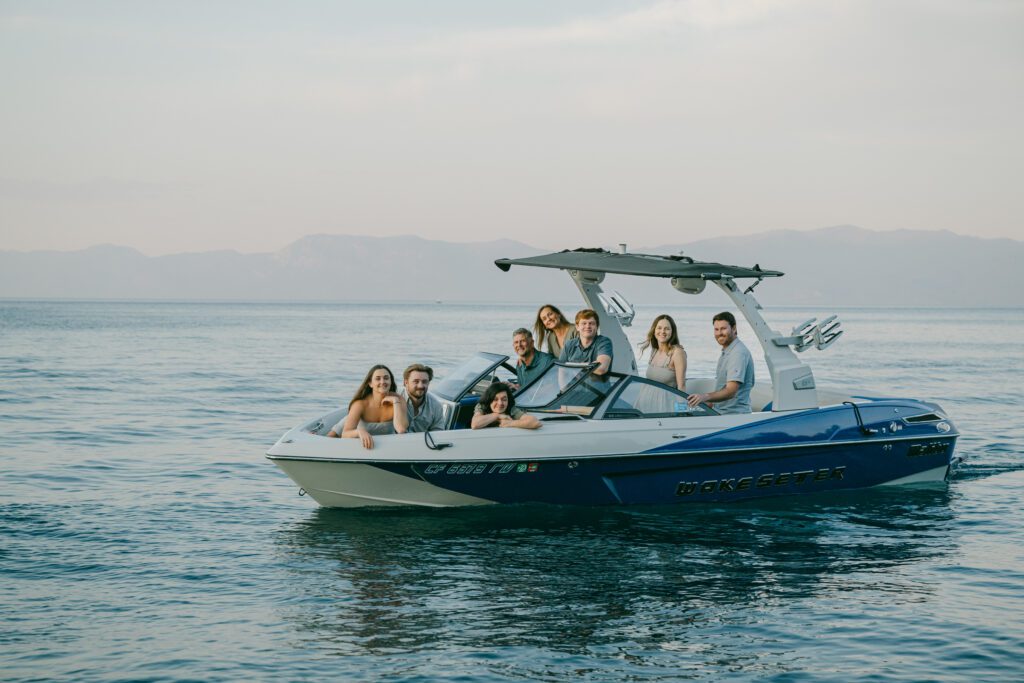 Lake Tahoe family photographer photo of family on a ski boat on Lake Tahoe at sunset