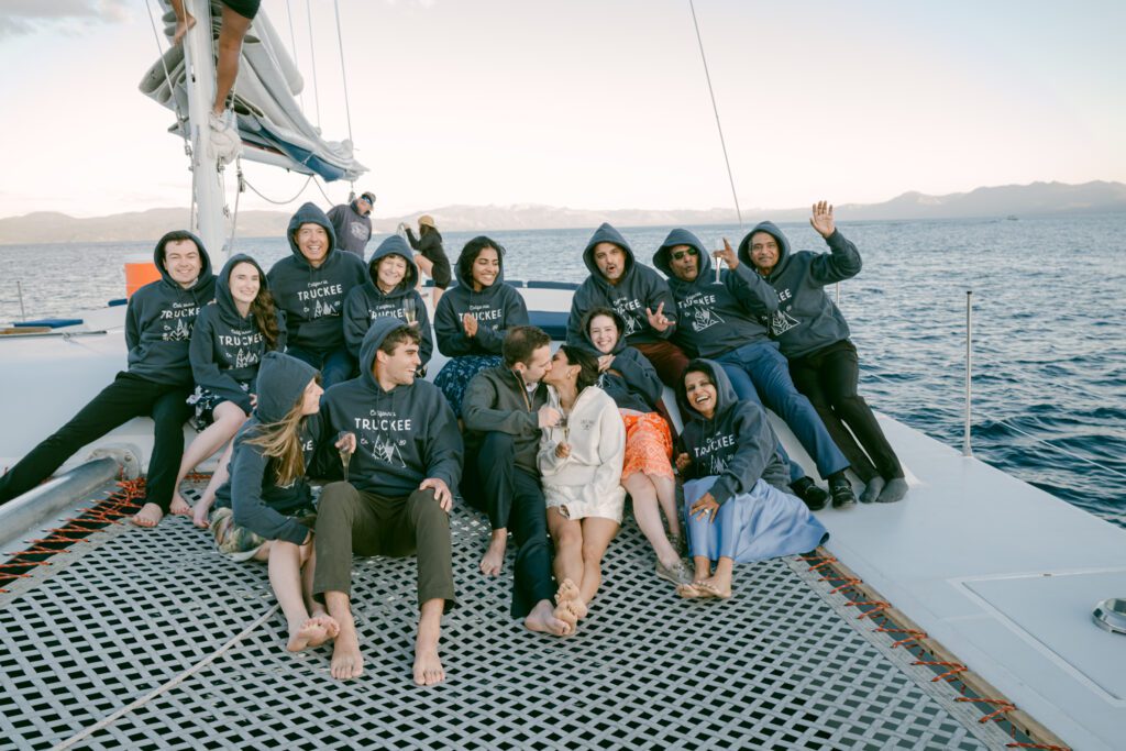family Guests enjoying the view during Lake Tahoe sailing wedding with their new california 89 Truckee sweatshirts