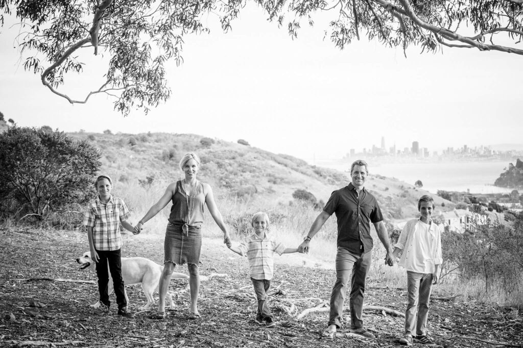 Marin family portrait photographer with family holding hands facing camera