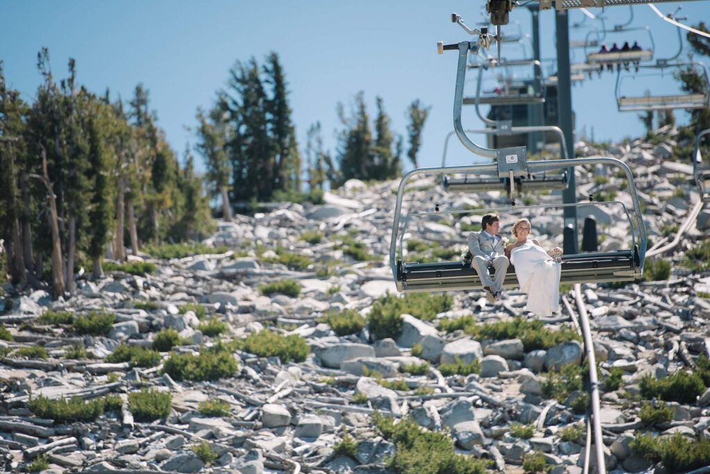 Newlyweds on chairlift coming down Heavenly resort in South Lake Tahoe captured by Tahoe photographer Annie X Photographie