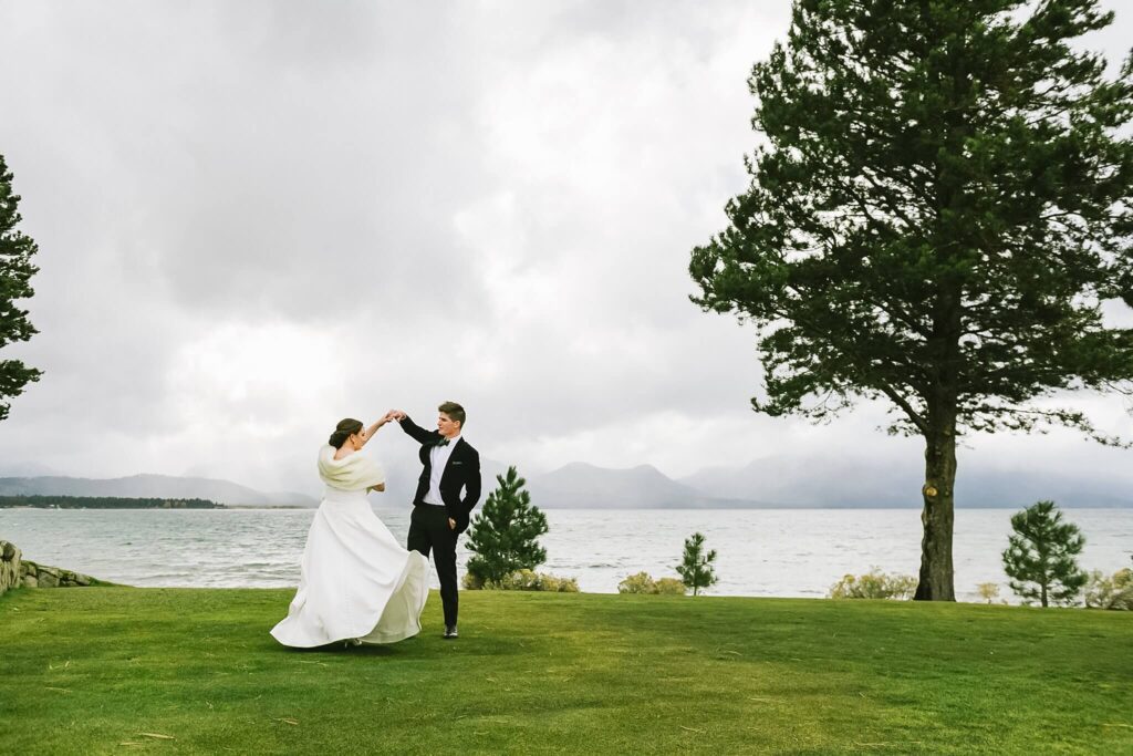 south lake tahoe wedding venue Edgewood on a storm day couple on front lawn