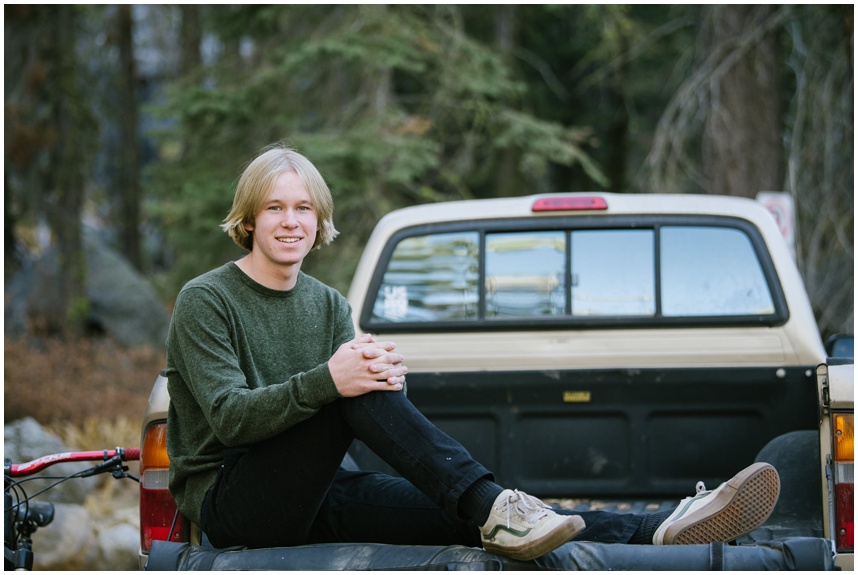 Truckee senior photos sitting in back of his tacoma