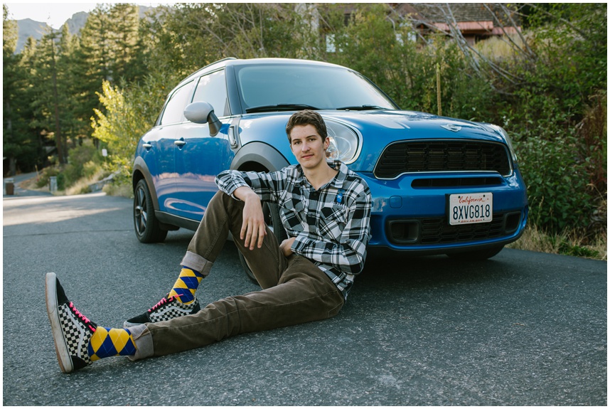 North Lake Tahoe senior photo featuring his Mini Cooper at a Olympic Valley overlook wearing his checked matching vans