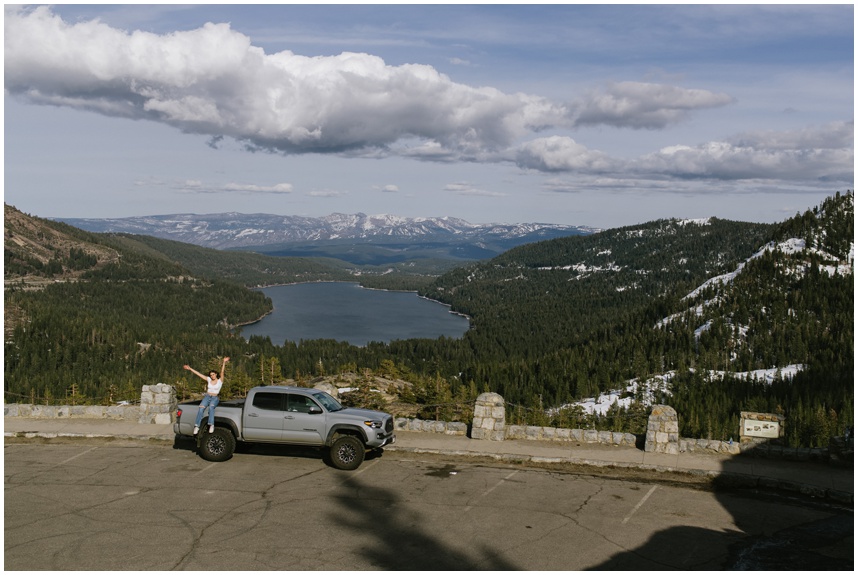 joyful senior tahoe photos of girl graduate with her tacoma overlooking Donner Lake