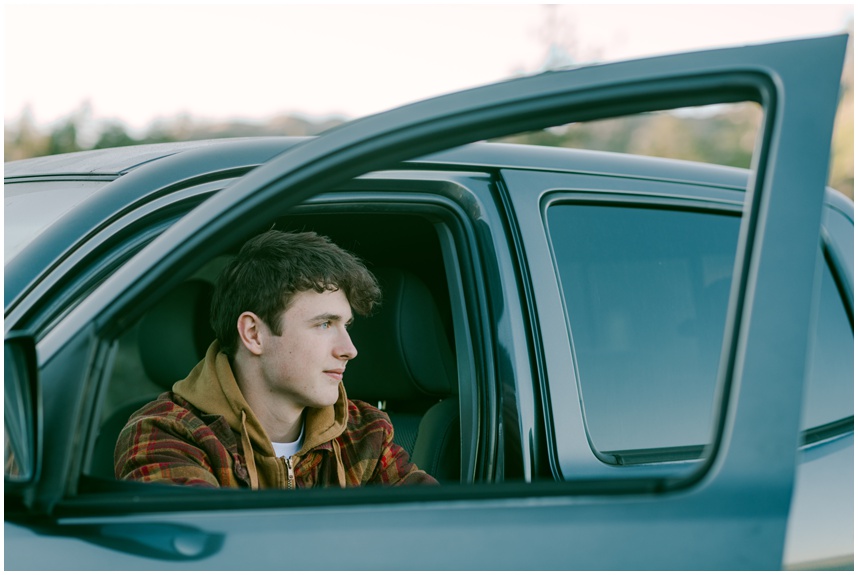 Truckee senior photographer capturing a quiet moment senior sitting in his Tacoma looking out