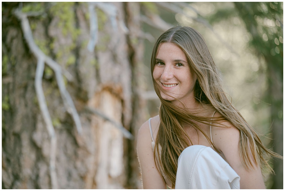 Tahoe senior photographer capturing a truckee high senior girl during a windy mountain session