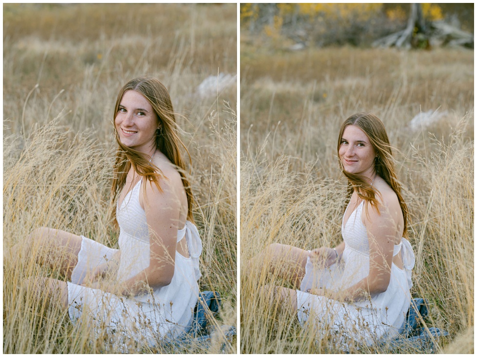 lake Tahoe senior sitting in tall blond grass in a meadow during a fall tos senior session captured by Annie X 