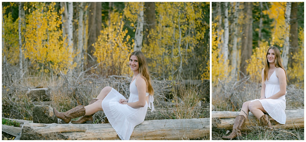 Tahoe senior photos of a girl in white dress and cowboy boots sitting on a log with yellow foliage behind