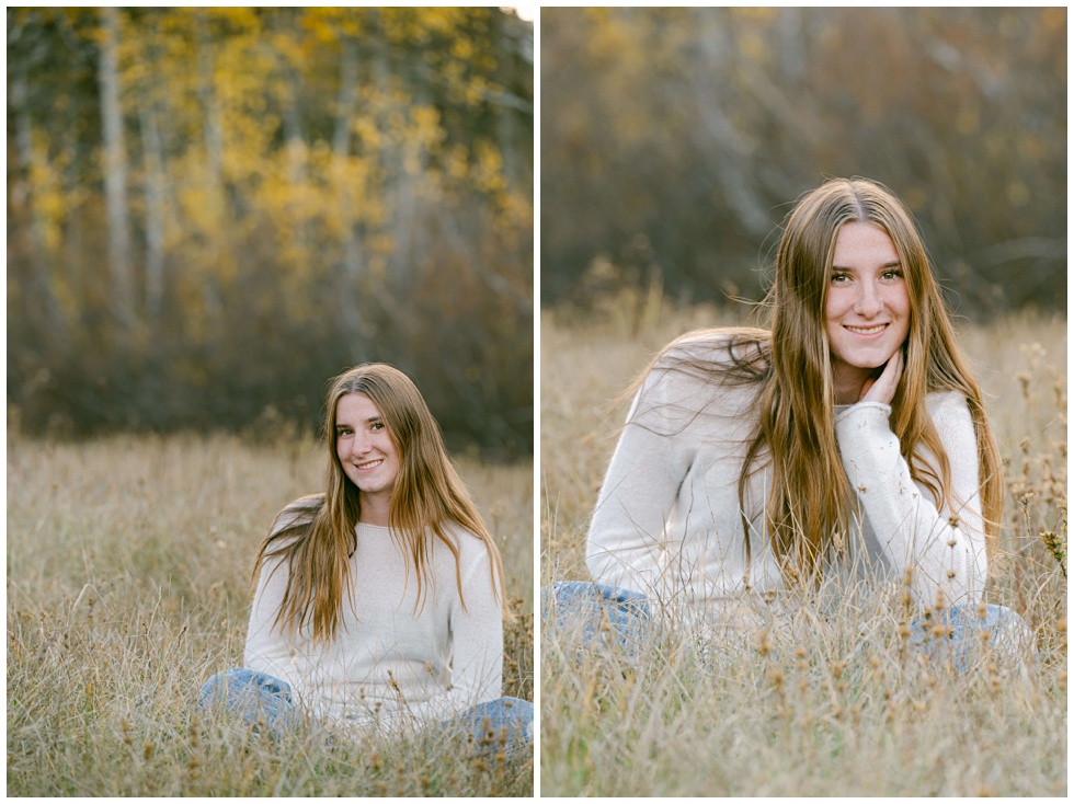Lake Tahoe senior photographer capturing senior fall photos in meadow in Tahoe. Senior girl sitting looking at camera