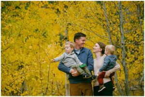 Fall family portrait session with toddlers in a full foliage meadow in Tahoe