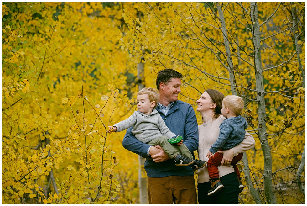 Fall family portrait session with toddlers in a full foliage meadow in Tahoe