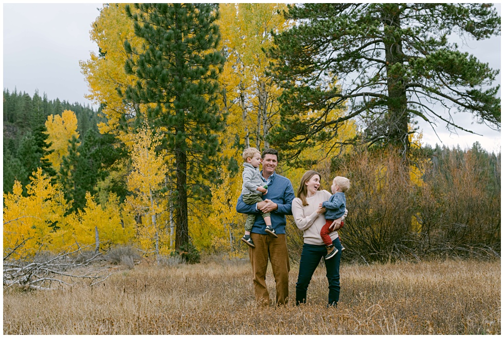 Lake Tahoe fall family portrait of parents and two toddlers in a Tahoe meadow in North tahoe photographed by Annie X Photographie