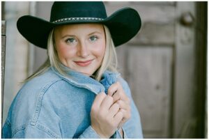 Tahoe senior portraits western inspired close up of senior girl facing camera with cowgirl hat