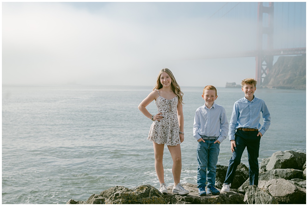 Sausalito family photos on a foggy morning with golden gate bridge in the background captured by Annie X Photographie