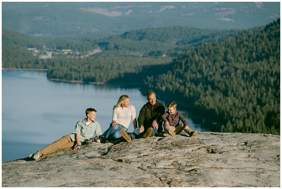 Donner Summit family photos of family sitting on granite boulders with Donenr Lake in the background