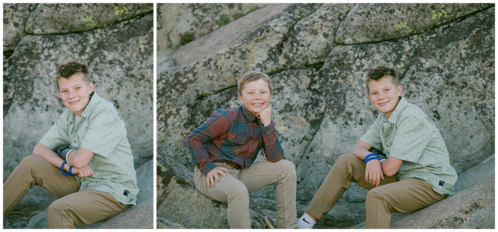 Brothers posing sitting on granite rock during Tahoe fall family phtoos captured by Annie X Photographie
