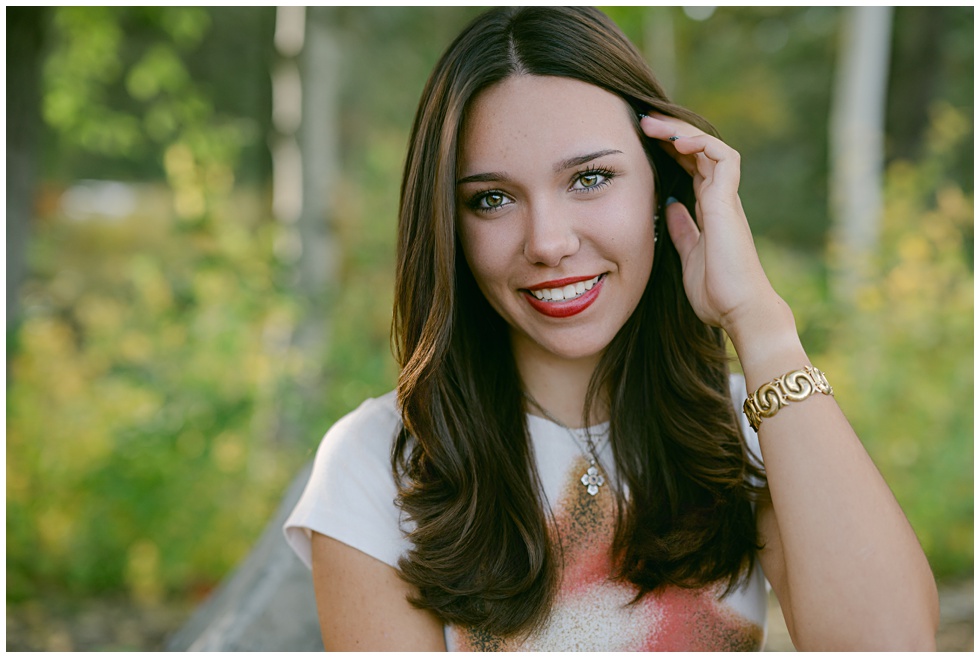 Close up portrait of senior girl with natural light in Olympic Valley with foliage and soft fall light