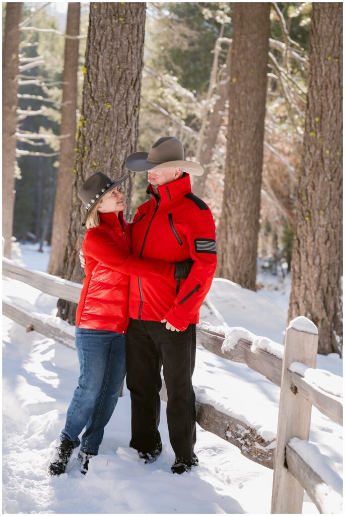Mom and Dad laughing together during cozy winter Truckee family photos.