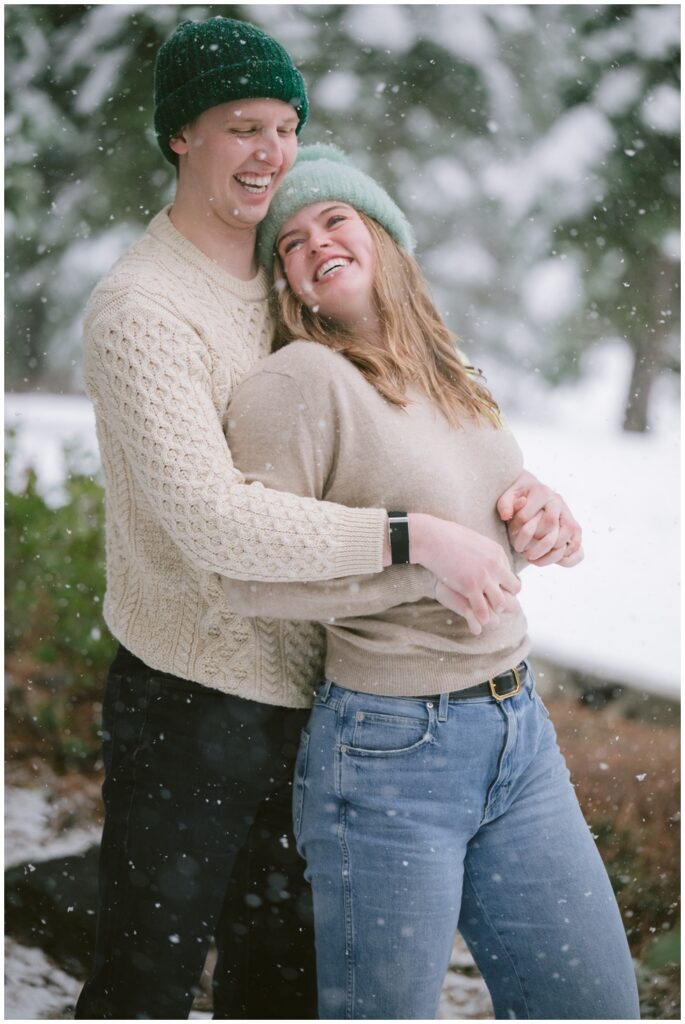 natural capture in snowstorm in Tahoe of a couple proposal and engagement session