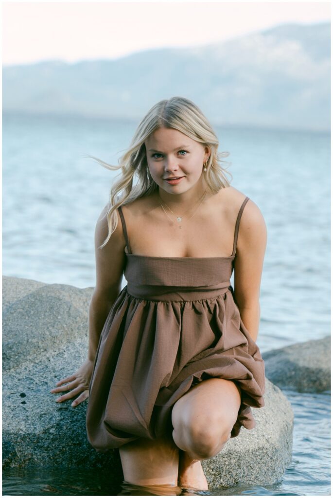 Here are all the missing alt texts in order: 260407_178 — brown dress, close up sitting on rock, lake behind, wind in hair, pearl earring: Truckee senior photographer close up portrait of Truckee High School senior in brown linen dress sitting on granite rock in the Lake at Sugar Pine Point with soft lake light and wind blown hair West Shore spring