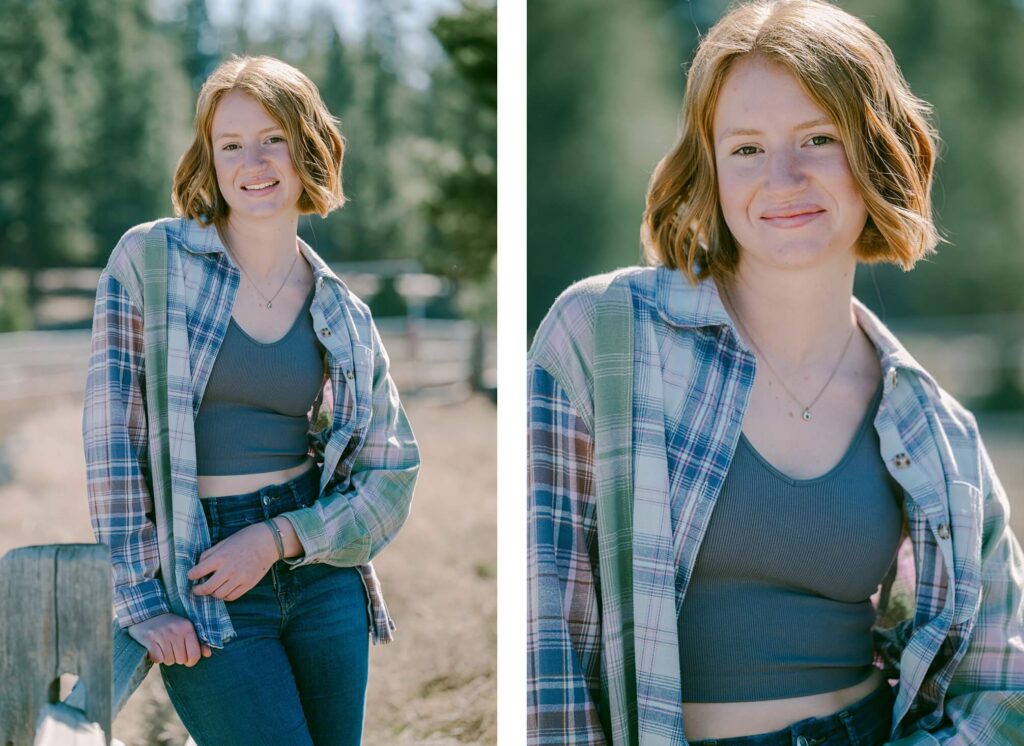 red hair senior gilr in a plaid shirt and jeans leaning on fence in truckee Piping Rock
