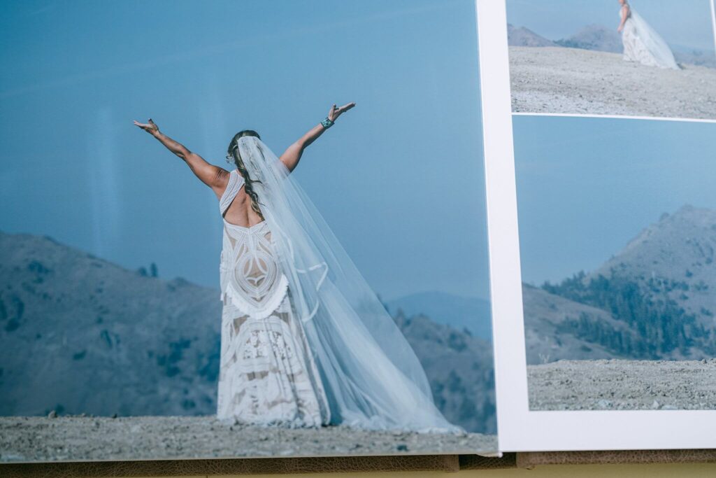 Bride arms up in the air walking toward= her bride at Palisades Tahoe wedding in teh fall