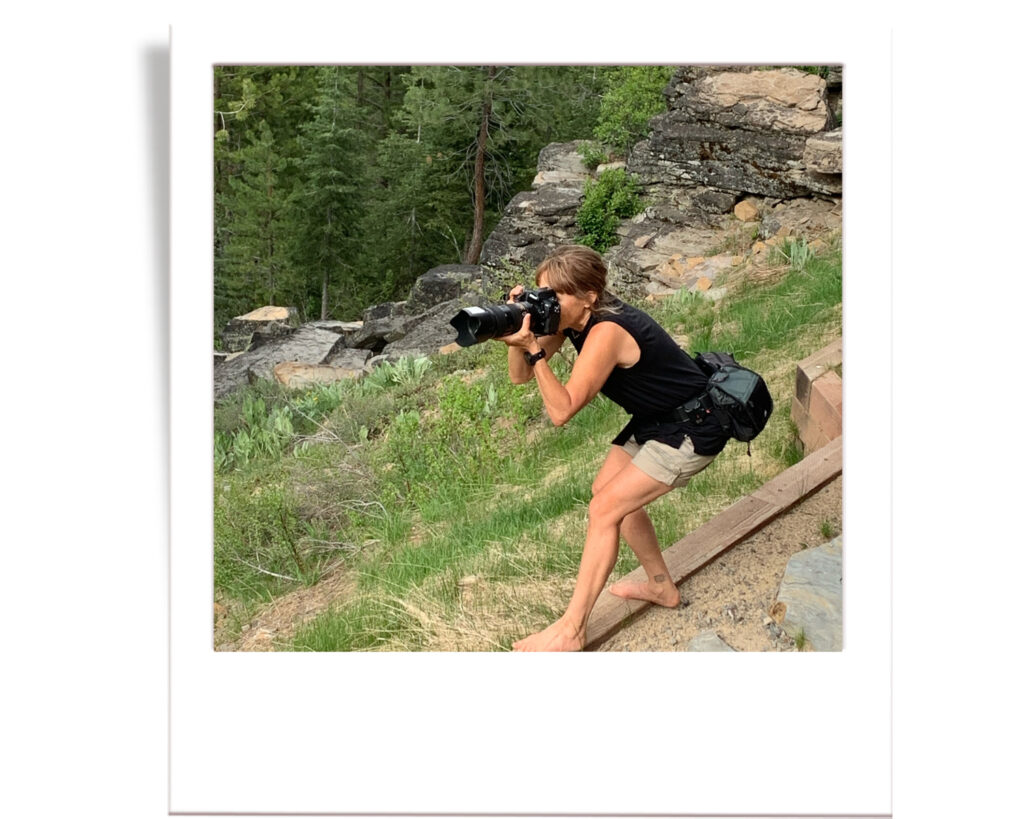 Annie X Photographie in action during a Senior session in Truckee outside on a ledge and camera in hand
